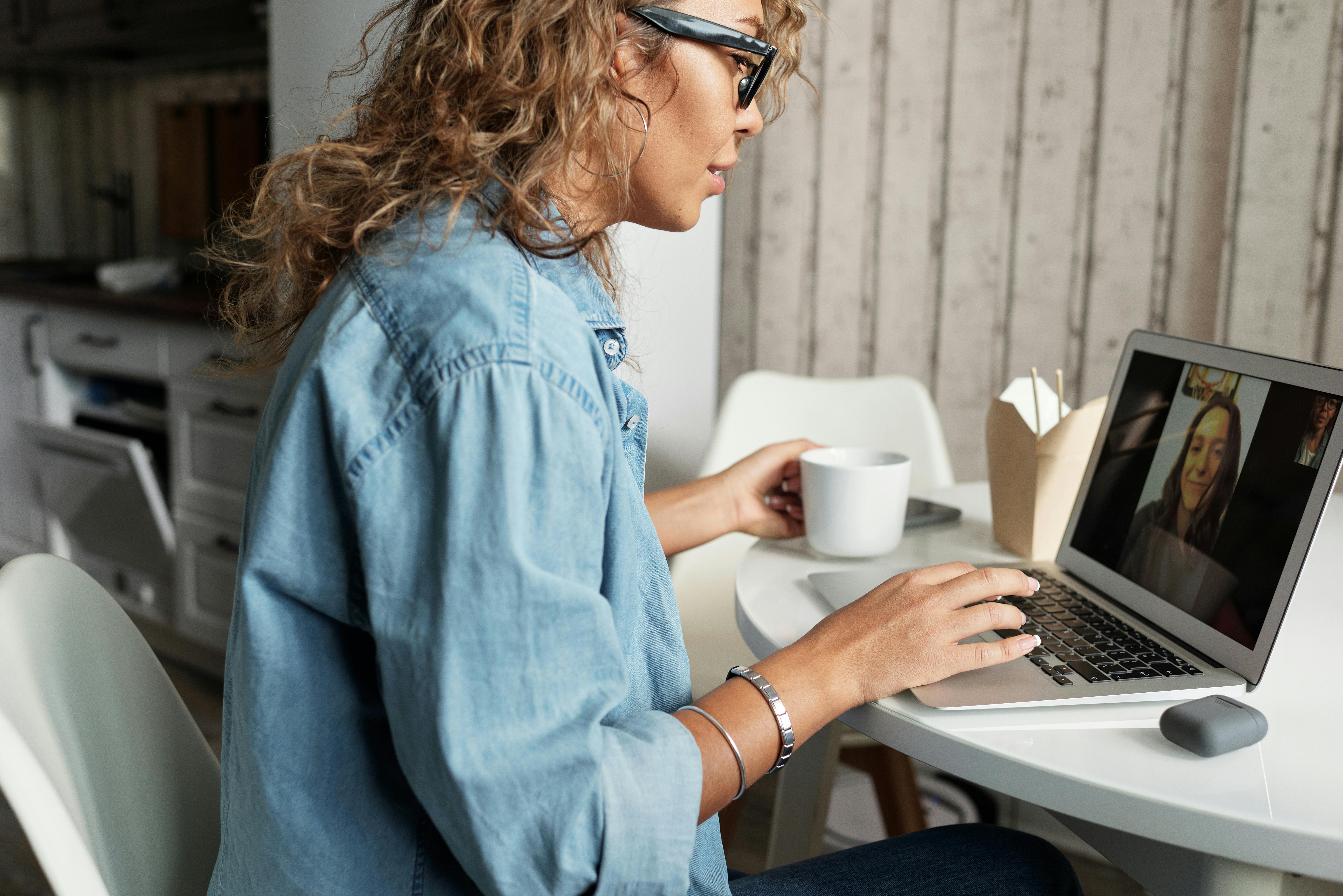 Women having vitural meeting on computer